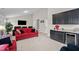 Spacious basement featuring a wet bar, comfortable seating area, and a large screen television at 1332 Gloriosa St, Apex, NC 27523