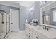 Beautiful bathroom with double vanity, sleek fixtures, and a glass-enclosed shower at 1332 Gloriosa St, Apex, NC 27523