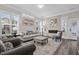 Stylish living room with plantation shutters, a modern fireplace, and sophisticated decor at 1332 Gloriosa St, Apex, NC 27523