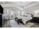 Serene main bedroom features vaulted ceilings, a sitting area, and french doors to an outside patio at 1332 Gloriosa St, Apex, NC 27523