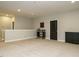 Spacious basement area with neutral carpeting, recessed lighting, and display cabinet at 136 Glenpark Pl, Cary, NC 27511