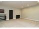 Spacious basement area with neutral carpeting, recessed lighting, and dark trim at 136 Glenpark Pl, Cary, NC 27511