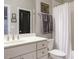 Bathroom with a white vanity, toilet and shower/tub featuring a white shower curtain at 136 Glenpark Pl, Cary, NC 27511