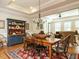 Elegant dining room with a wooden table, chandelier, and view into the living room at 136 Glenpark Pl, Cary, NC 27511