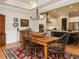 Cozy dining room showcasing a wooden table, decorative plates and view to the kitchen at 136 Glenpark Pl, Cary, NC 27511
