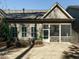 Exterior view of a house with a screened porch and well-maintained landscaping at 136 Glenpark Pl, Cary, NC 27511