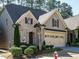Exterior of the home showing brick facade, a well manicured lawn, and a fire hydrant near the sidewalk at 136 Glenpark Pl, Cary, NC 27511