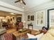 Open concept living area with hardwood floors connecting to the dining room and kitchen at 136 Glenpark Pl, Cary, NC 27511
