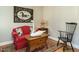 Cozy interior living space featuring a red sofa, swan statue, and unique decor at 136 Glenpark Pl, Cary, NC 27511