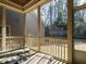 Inviting screened porch with comfortable seating and natural light at 136 Glenpark Pl, Cary, NC 27511