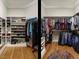 Spacious walk-in closet with custom shelving and racks for optimal storage at 136 Glenpark Pl, Cary, NC 27511