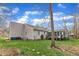 Spacious backyard with a screened porch, perfect for outdoor gatherings and relaxation at 1410 Briardale Ln, Durham, NC 27712