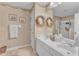 Light and bright bathroom with double sink and nicely decorated with wreaths at 1410 Briardale Ln, Durham, NC 27712
