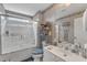 Bright bathroom featuring tub with glass door and nice vanity space to store your necessities at 1410 Briardale Ln, Durham, NC 27712