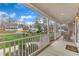 Relaxing covered front porch with rocking chairs and scenic views of the neighborhood at 1410 Briardale Ln, Durham, NC 27712