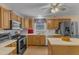 Cozy eat-in kitchen features stainless steel appliances, ample wooden cabinets, and a center island at 1410 Briardale Ln, Durham, NC 27712