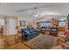 Expansive living area with hardwood floors, a fireplace, and direct access to the dining area and kitchen at 1410 Briardale Ln, Durham, NC 27712