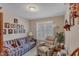 Cozy living room featuring comfortable seating, neutral walls, and a bright window at 1410 Briardale Ln, Durham, NC 27712