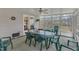 Spacious sunroom with abundant windows and a ceiling fan is great for relaxing or entertaining at 1410 Briardale Ln, Durham, NC 27712