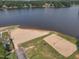 Aerial view of the community beach, volleyball court, and covered picnic area at 1429 Sagamore Dr, Louisburg, NC 27549
