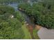 Aerial view of a home's private boat dock and lake access, nestled among lush greenery at 1429 Sagamore Dr, Louisburg, NC 27549