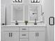 Bathroom featuring double vanity, granite countertops, and a glass shower at 1429 Sagamore Dr, Louisburg, NC 27549