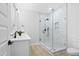 Modern bathroom with glass shower, and granite countertops at 1429 Sagamore Dr, Louisburg, NC 27549