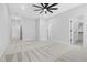 Spacious bedroom with carpet, ceiling fan, and multiple doors at 1429 Sagamore Dr, Louisburg, NC 27549