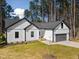 New home with board and batten siding, and well-manicured front lawn at 1429 Sagamore Dr, Louisburg, NC 27549