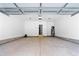 Spacious two-car garage with painted floor, water heater and high ceilings at 1429 Sagamore Dr, Louisburg, NC 27549