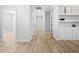 Bright hallway featuring wood-look flooring and access to multiple rooms at 1429 Sagamore Dr, Louisburg, NC 27549