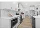 A kitchen showcasing white cabinets, granite countertops, and stainless steel appliances at 1429 Sagamore Dr, Louisburg, NC 27549