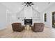 Living room featuring a fireplace and plush seating, bathed in natural light, with wood-look floors at 1429 Sagamore Dr, Louisburg, NC 27549