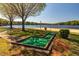 Enjoy the community's mini golf area with lake view and access to the volleyball court and sandy beach at 1429 Sagamore Dr, Louisburg, NC 27549