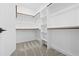 Walk-in closet featuring built-in shelves and rods at 1429 Sagamore Dr, Louisburg, NC 27549