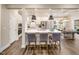 Open kitchen with white cabinetry, stainless steel appliances, and an eat-in kitchen island at 1505 Bright Coral Trl, Wendell, NC 27591