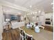 Open-concept living space with kitchen, dining area, and a cozy seating area at 1505 Bright Coral Trl, Wendell, NC 27591