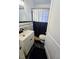 Cozy bathroom featuring a stylish vanity and black and white shower curtain at 1522 W Thomas St, Rocky Mount, NC 27804