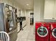 The kitchen has an adjacent laundry area with stacked red front load machines at 1522 W Thomas St, Rocky Mount, NC 27804