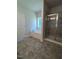 Bright bathroom featuring a large tub, separate shower, and modern gray flooring at 1579 Pecan Drive # 29, Nashville, NC 27856