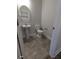 Cozy powder room features pedestal sink, oval mirror, and neutral wall color at 1579 Pecan Drive # 29, Nashville, NC 27856