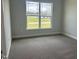 Carpeted bedroom with a bright window at 1579 Pecan Drive # 29, Nashville, NC 27856