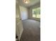 Bedroom with carpeting and a window overlooking greenery at 1579 Pecan Drive # 29, Nashville, NC 27856