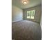 Carpeted bedroom with a window offering natural light at 1579 Pecan Drive # 29, Nashville, NC 27856