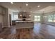Open kitchen with an island and stainless steel appliances flows to dining area at 1579 Pecan Drive # 29, Nashville, NC 27856