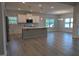 Bright kitchen with white cabinets, island, stainless steel appliances and open floorplan at 1579 Pecan Drive # 29, Nashville, NC 27856