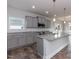 Modern kitchen boasts gray cabinets, granite countertops, stainless steel appliances, and a large island at 1579 Pecan Drive # 29, Nashville, NC 27856