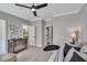 Bright bedroom with neutral paint, a ceiling fan, and a combination crib and daybed at 1801 Clifton Pines Dr, Cary, NC 27519