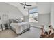 Well-lit bedroom featuring a ceiling fan, large windows and a comfortable queen size bed at 1801 Clifton Pines Dr, Cary, NC 27519