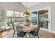 Bright dining room with large windows, a round table, and a view of the outdoors at 1801 Clifton Pines Dr, Cary, NC 27519